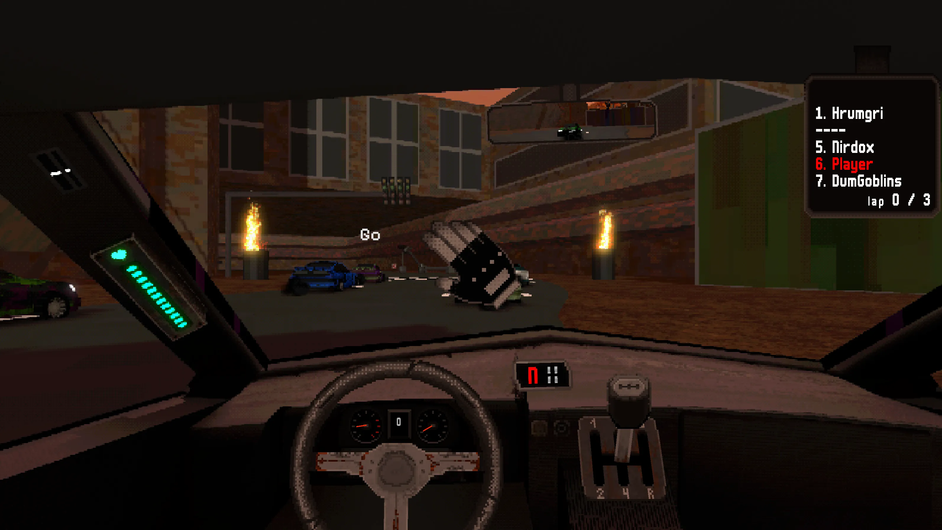 Fire Factory: brick factory buildings and burning torches, rival cars lined up at the start.